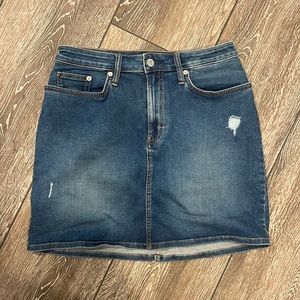 BARELY WORN Dark wash Calvin Klein, jeans skirt, with a few distressed marks